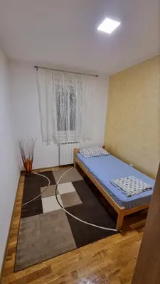 a bedroom with a bed in a room at Raven2 in Železnik