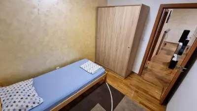 a small room with a bed and a door at Raven2 in Železnik