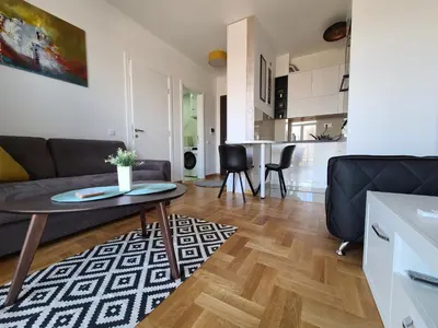 a living room with a couch and a table at Bella Vita Dorćol in Belgrade