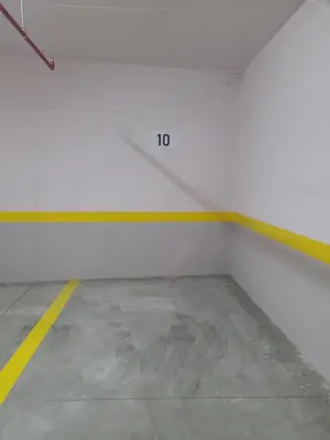 an empty garage with a yellow and white wall at Bella Vita Dorćol in Belgrade