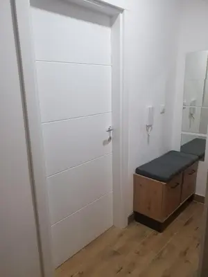 a small bathroom with a bench in a room at Relax, apartman sa garažnim mestom in Obrenovac