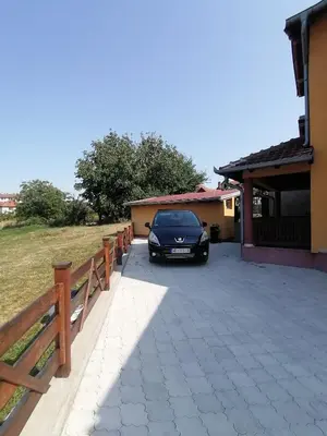 a car parked in the driveway of a house at Apartman Panorama Arandjelovac in Arandjelovac