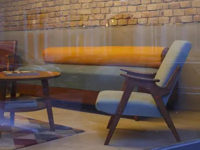 a chair and a table in a window at Savamala b&b in Belgrade