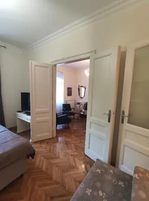 a room with a door open to a living room at Skorpion in Belgrade