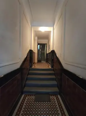 an empty hallway with stairs in a building at Skorpion in Belgrade