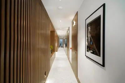 a hallway of a house with a picture on the wall at Dominic Smart & Luxury Suites - Edition in Belgrade