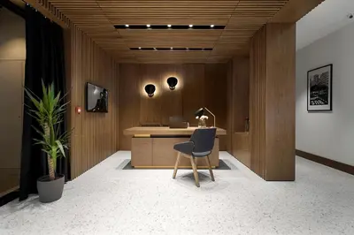 an office with a chair and a desk with a laptop at Dominic Smart & Luxury Suites - Edition in Belgrade