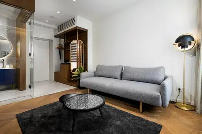 a living room with a couch and a table at Dominic Smart & Luxury Suites - Edition in Belgrade