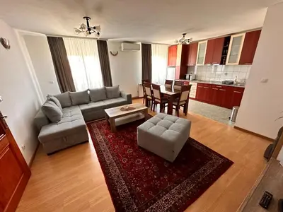a living room with a couch and a table at Helena apartment in Belgrade