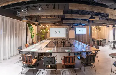 a large conference room with a large table and chairs at Joy 5 Hotel & SPA in Belgrade