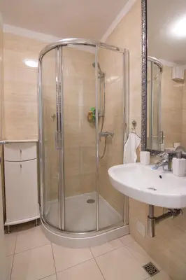 a bathroom with a shower and a sink at A Blok New Modern - Free garage parking, comfortable, quiet with a park view in Belgrade