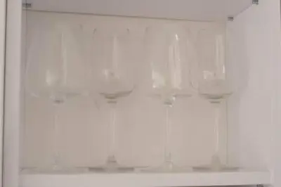 a shelf with wine glasses on it in a bathroom at A Blok New Modern - Free garage parking, comfortable, quiet with a park view in Belgrade