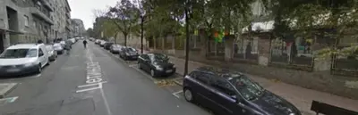 a street with cars parked on the side of the road at Cozy apartment in the center of Belgrade - living room, bedroom and bathroom in Belgrade