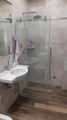 a bathroom with a shower and a sink at Cozy apartment in the center of Belgrade - living room, bedroom and bathroom in Belgrade