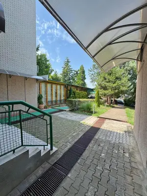 an external view of a building with a retractable roof at Vila club 011 in Dedinje