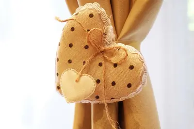 a brown curtain with a heart bow on it at Studio Paradise Forest in Belgrade