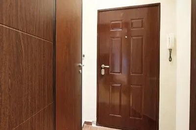 a wooden door in a room next to a door at Studio Paradise Forest in Belgrade