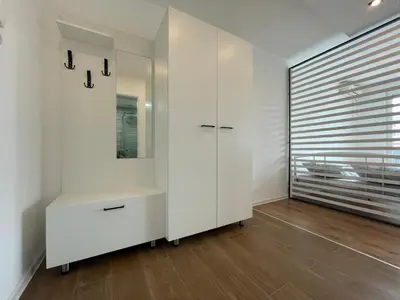 a room with a white cabinet and a mirror at Apartment Vanilla Belgrade in Belgrade