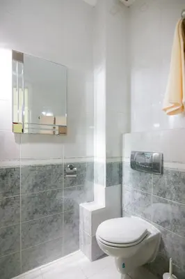 a bathroom with a toilet and a glass shower at Central Park Residence in Belgrade