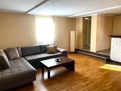a living room with a couch and a coffee table at Central Park Residence in Belgrade