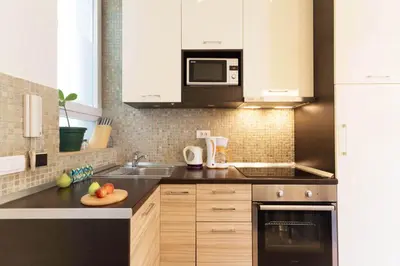 a kitchen with a sink and a microwave at City Break Apartments Chic and Luxury in Belgrade