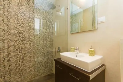 a bathroom with a sink and a shower at City Break Apartments Chic and Luxury in Belgrade