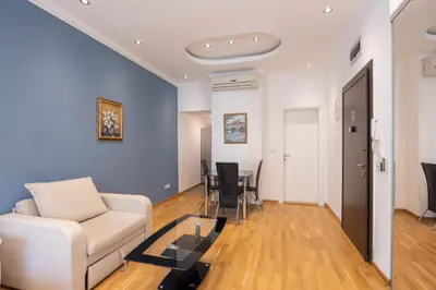 a living room with a couch and a table at Belgrade Center Apartment Lux III in Belgrade