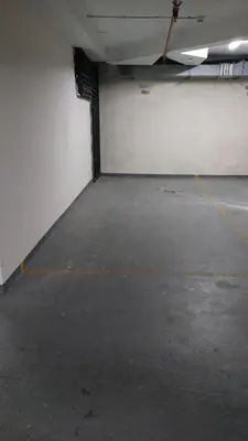 an empty parking garage with a white wall at Belgrade Center Apartment Lux III in Belgrade