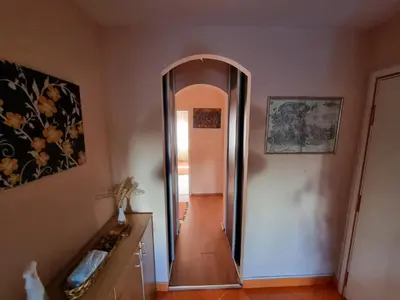 a hallway with a mirror in a room at Large, Spacious Apartment Voždovac in Belgrade