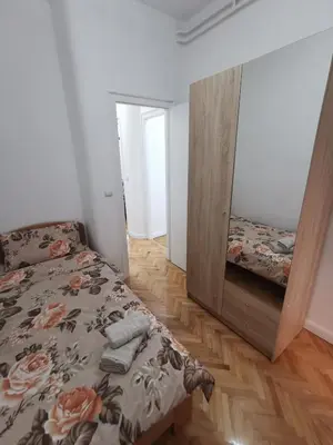 a bedroom with a bed and a large mirror at Victory apartment - Heart of Belgrade in Belgrade