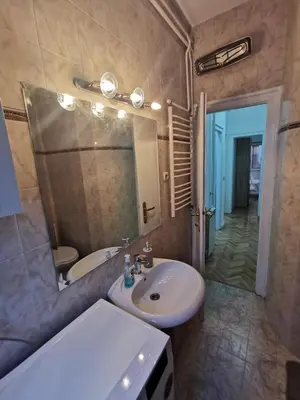 a bathroom with a sink and a mirror at Victory apartment - Heart of Belgrade in Belgrade