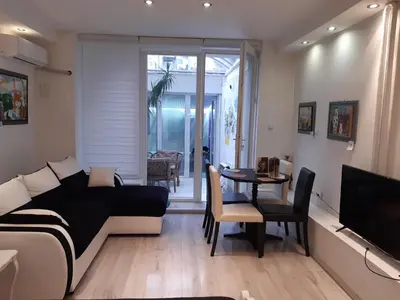 a living room with a couch and a table at Viktoria in Belgrade