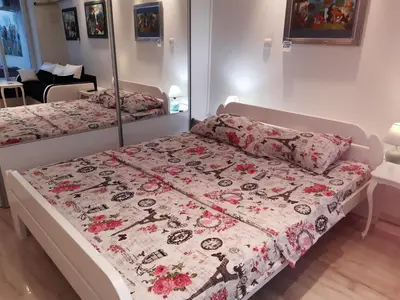 a bedroom with two beds with a floral bedspread at Viktoria brdo in Žarkovo