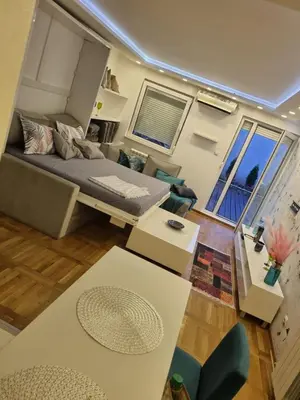 an overhead view of a living room with a bed at Babilon in Vračar (historical)