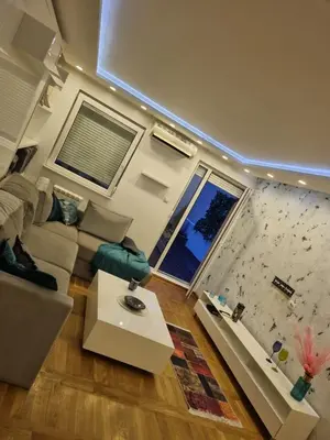 a living room with a couch and a window at Babilon in Vračar (historical)