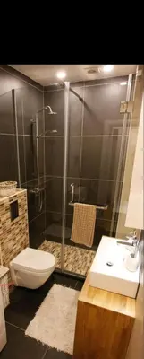 a bathroom with a shower and a toilet and a sink at Babilon in Vračar (historical)