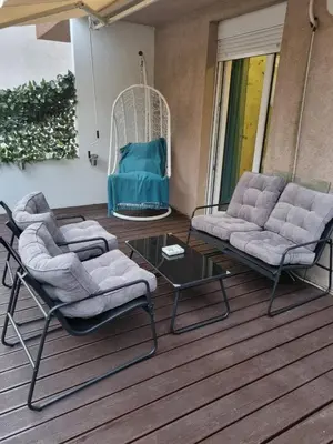a porch with two chairs and a table and a swing at Babilon in Vračar (historical)