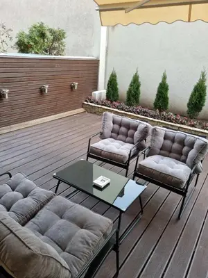 a patio with two couches and a coffee table at Babilon in Vračar (historical)