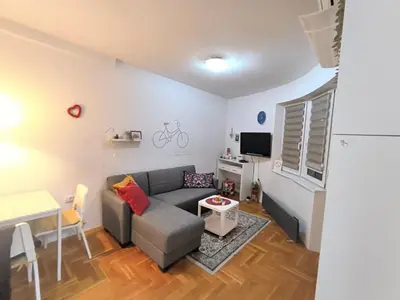 a living room with a couch and a table at ANKA apartman in Smederevo