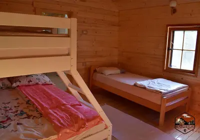 a bedroom with two bunk beds and a window at Baberius in Babe