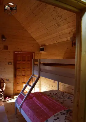 a bedroom with a bunk bed in a cabin at Baberius in Babe