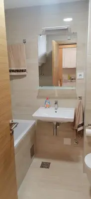 a bathroom with a sink and a mirror at MoonZe Gate in Belgrade