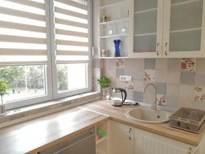 a kitchen with a sink and a window at Kalemegra in Belgrade