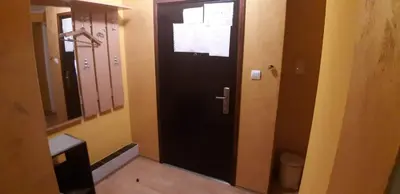 a bathroom with a black door and a toilet at Rosso Apartments in Belgrade