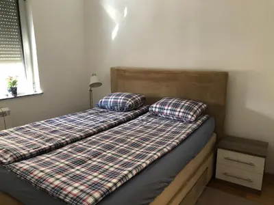 a bed with two pillows on it in a bedroom at Modern 1 Bed Apartment, near shopping mall Stadion in Belgrade