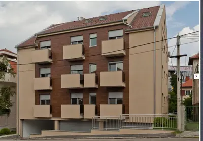 an apartment building with boxes on the side of it at Modern 1 Bed Apartment, near shopping mall Stadion in Belgrade