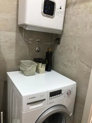 a washer and dryer in a small room at Modern 1 Bed Apartment, near shopping mall Stadion in Belgrade