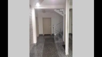 an empty hallway with a staircase in a building at Modern 1 Bed Apartment, near shopping mall Stadion in Belgrade