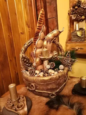 a statue of a hand holding a candle on a table at Etno kuća Teodora in Staji°evo