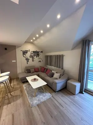 a living room with a couch and a table at Apartments LaVu in Belgrade